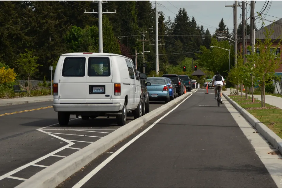 Cyclist rides in protected bike lane in Jacksonville, Florida.